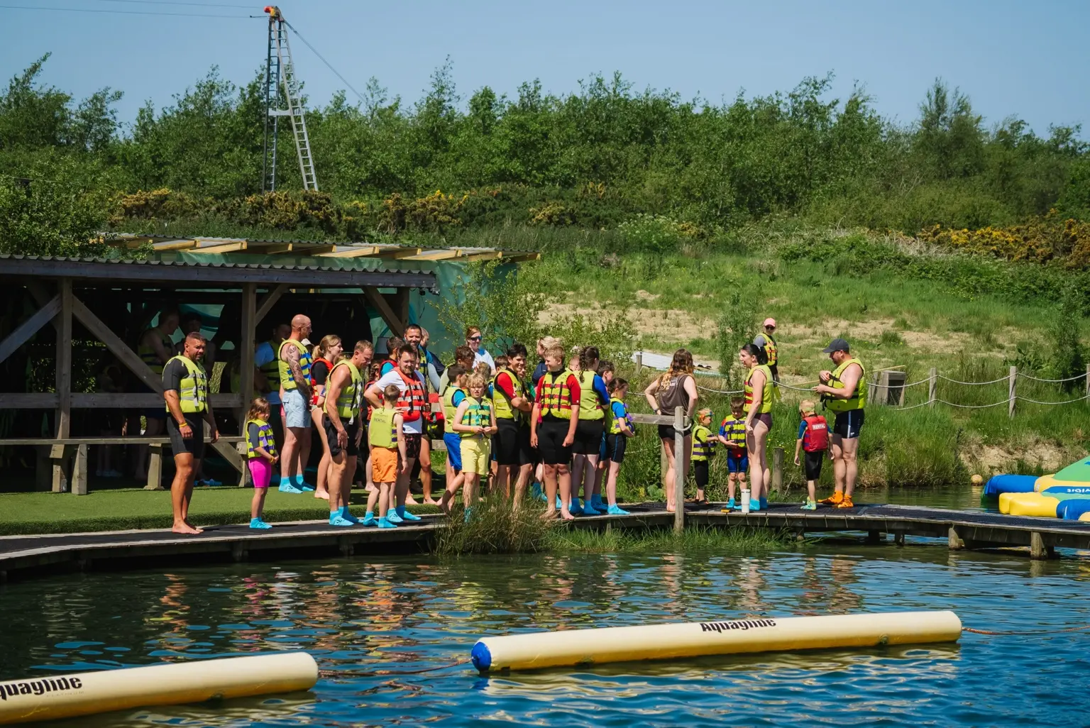Customers and staff preparing for watersports sessions at North Devon Wake Park